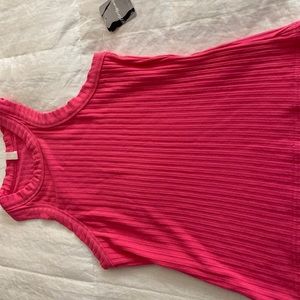 Cute pink tang top from free people. XS NWT and very soft.